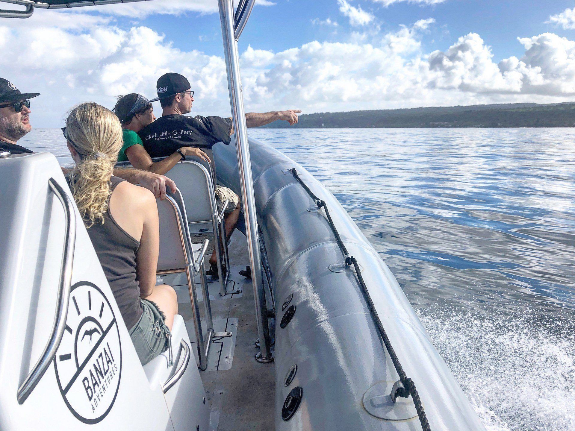Image of a zodiac boat tour on the coast of Oahu. Whale watching tours are a popular way for visitors to spend time on the island's North Shore. Whale watching in Oahu.