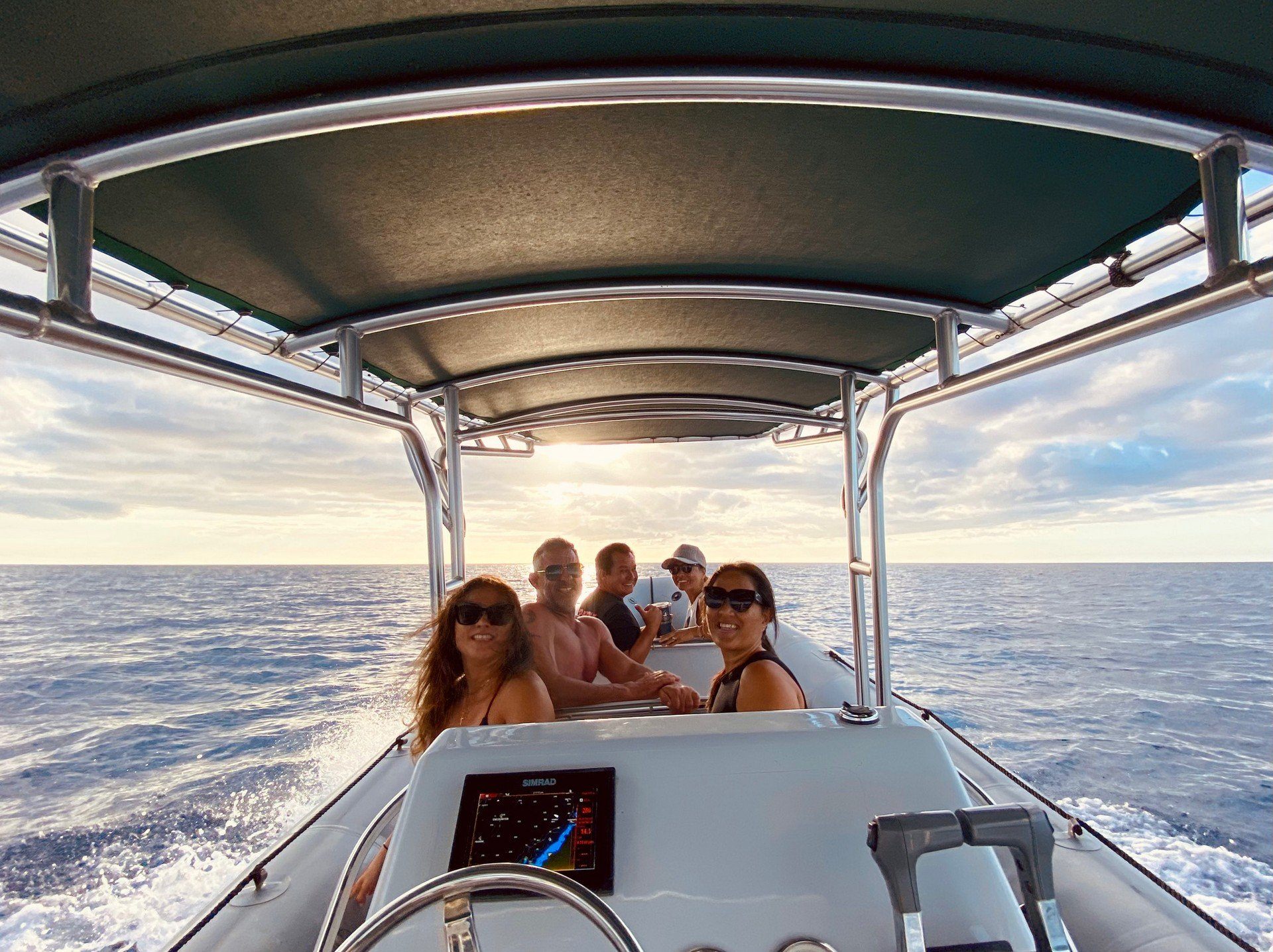 People on North Shore boat tours, Oahu shark tours, North Shore sightseeing tours with Banzai Adventures tour boat.